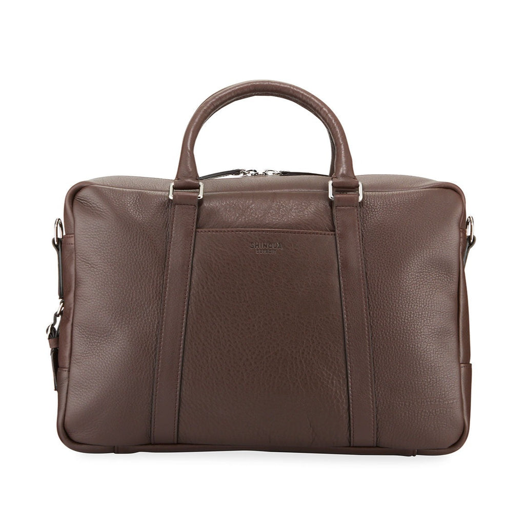 Shinola brown leather briefcase with sterling silver hardware, front view