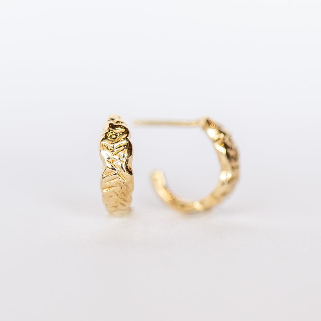 Communion by Joy hand carved yellow gold hoop earrings.