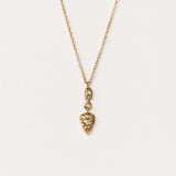 Hand carved yellow gold and diamond pendant from Communion by Joy.