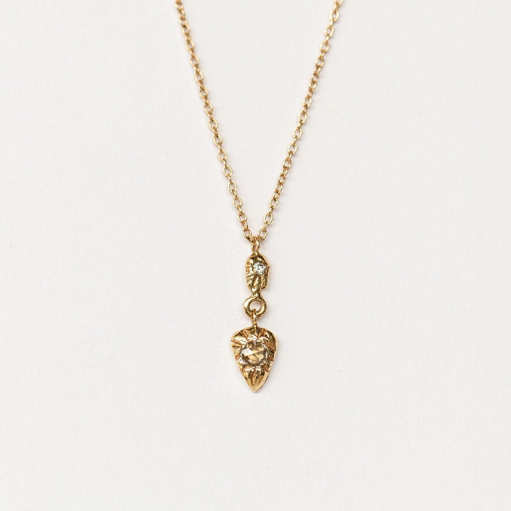 Hand carved yellow gold and diamond pendant from Communion by Joy.