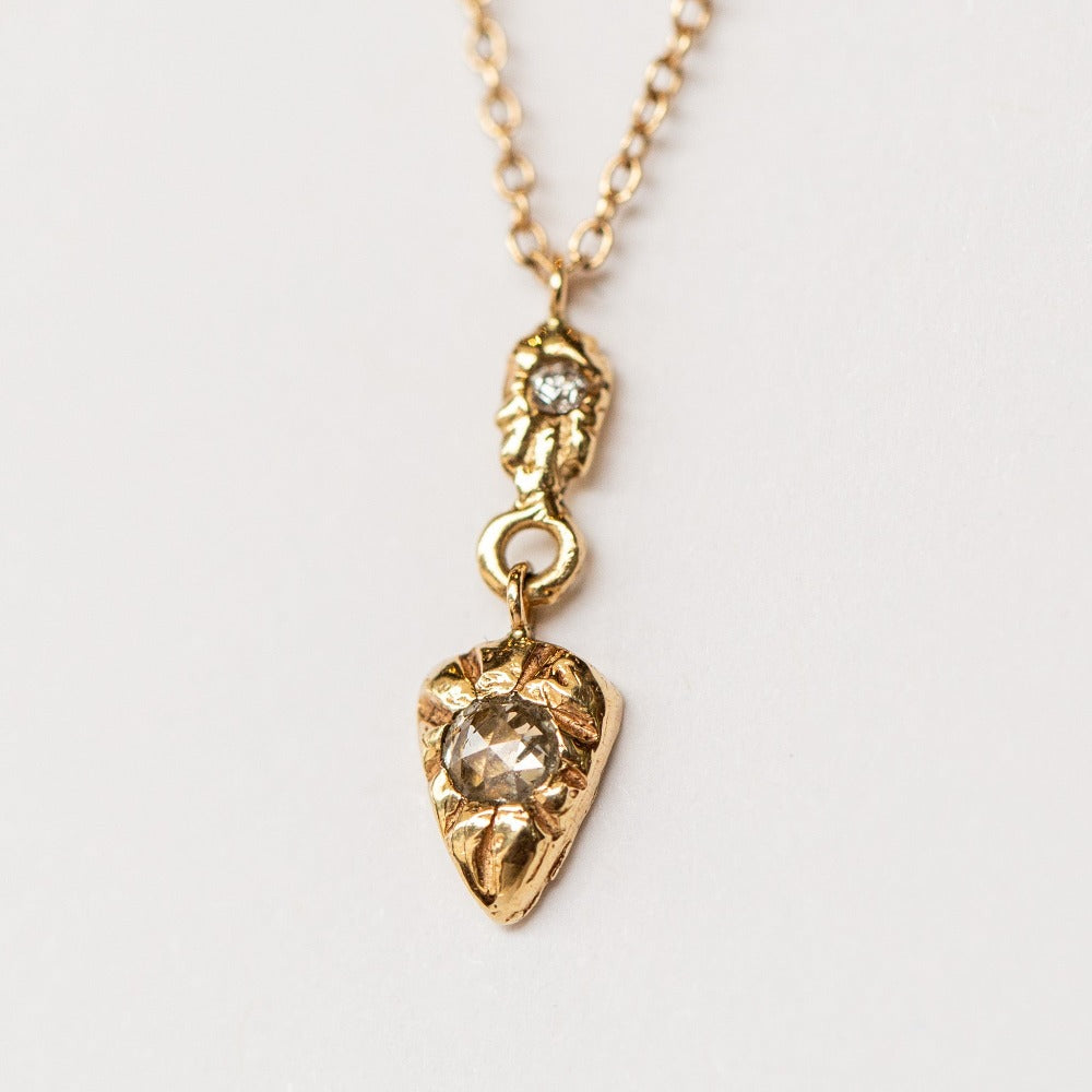 Hand carved yellow gold and diamond pendant from Communion by Joy.