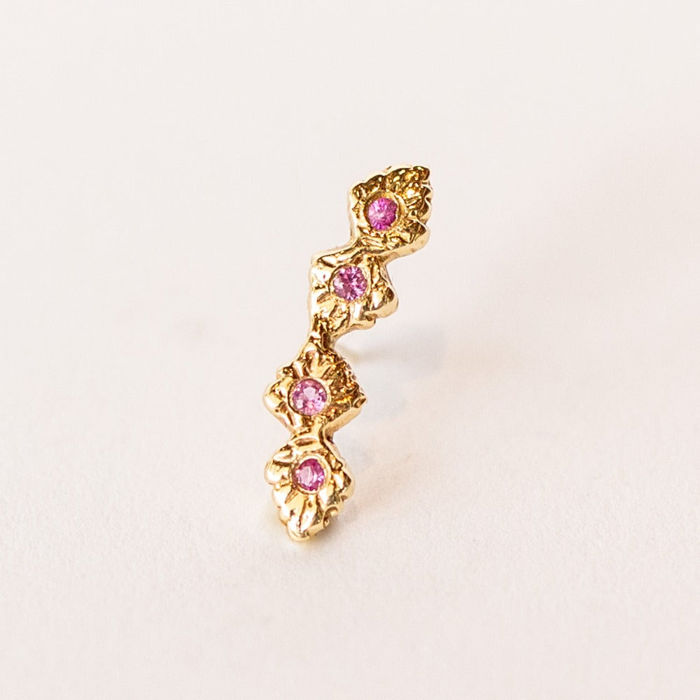 Yellow gold, carved ear climber stud featuring pink sapphires from Communion by Joy.