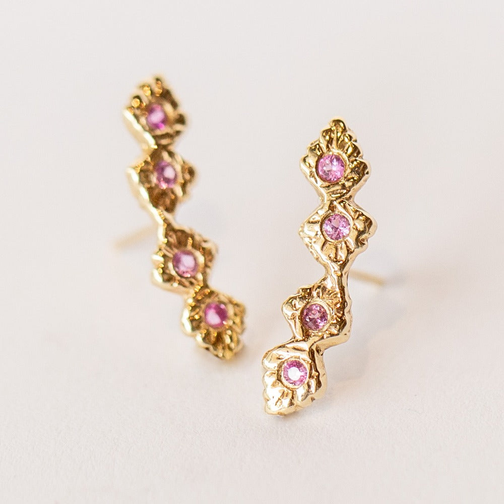 Yellow gold, carved ear climber stud featuring pink sapphires from Communion by Joy.