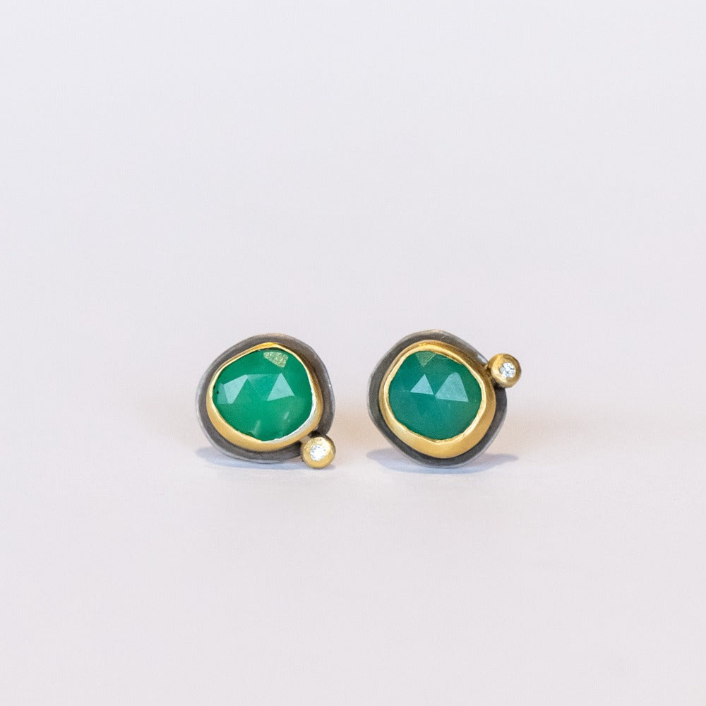 Petite stud earrings featuring apple-green faceted chrysoprase gemstones set in yellow gold with tiny diamond accents and silver backings.