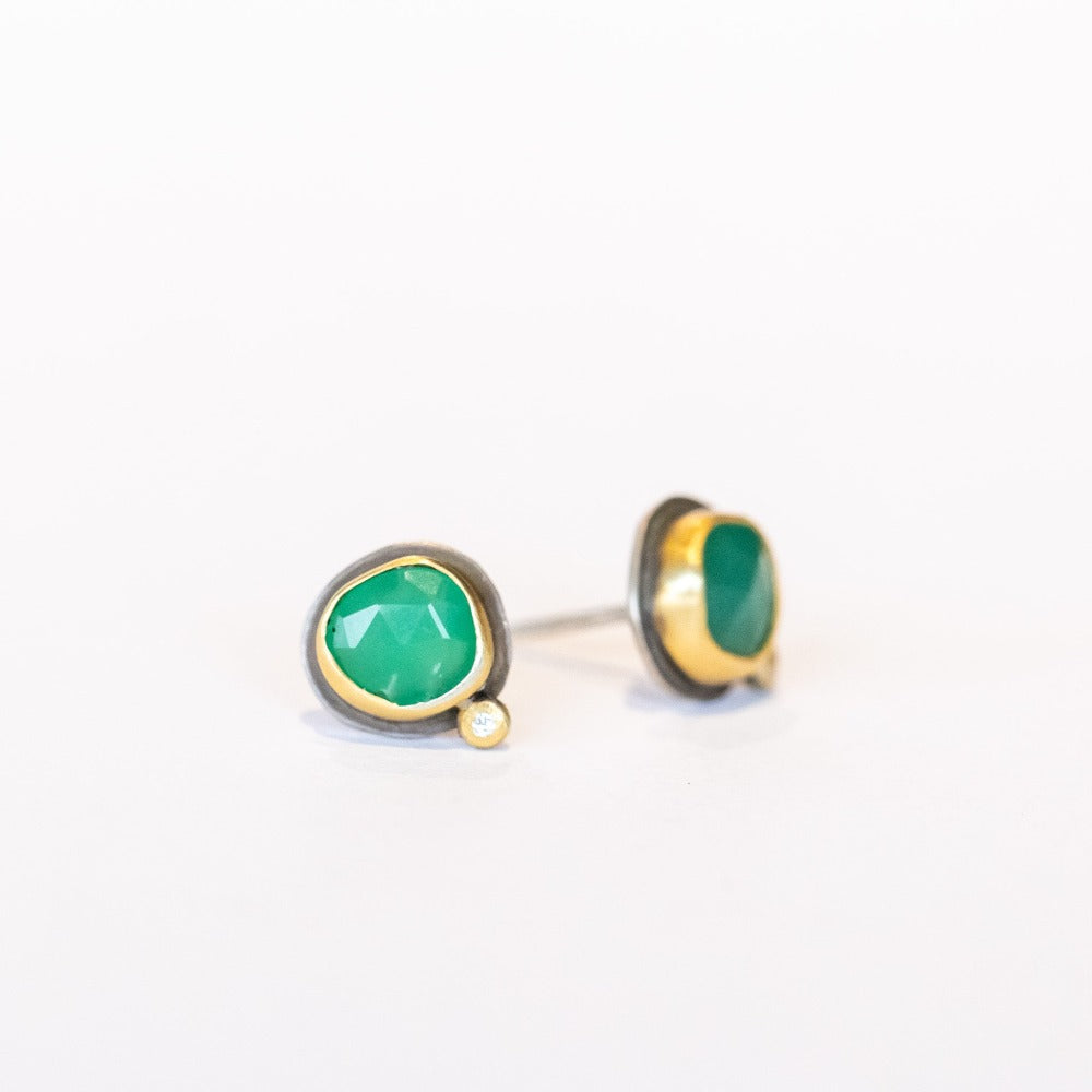 Petite stud earrings featuring apple-green faceted chrysoprase gemstones set in yellow gold with tiny diamond accents and silver backings.