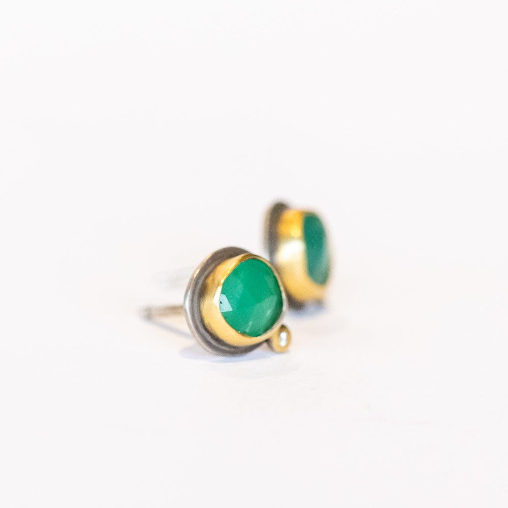 Petite stud earrings featuring apple-green faceted chrysoprase gemstones set in yellow gold with tiny diamond accents and silver backings.