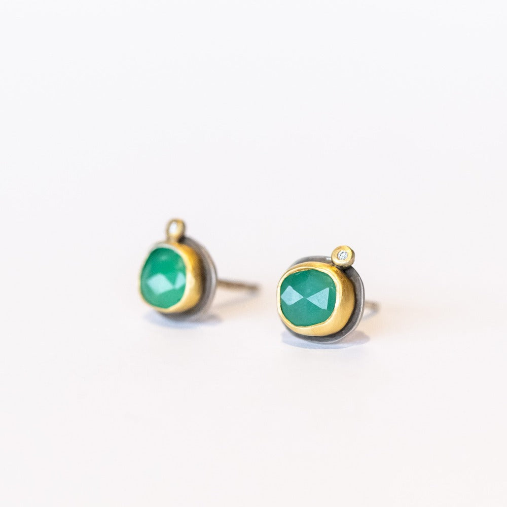 Petite stud earrings featuring apple-green faceted chrysoprase gemstones set in yellow gold with tiny diamond accents and silver backings.
