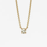 A prong set old mine cut diamond station pendant on a yellow gold cable chain necklace.