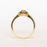 A rose cut cushion shaped diamond solitaire ring, set in an 8-prong, 18 karat yellow gold mounting.