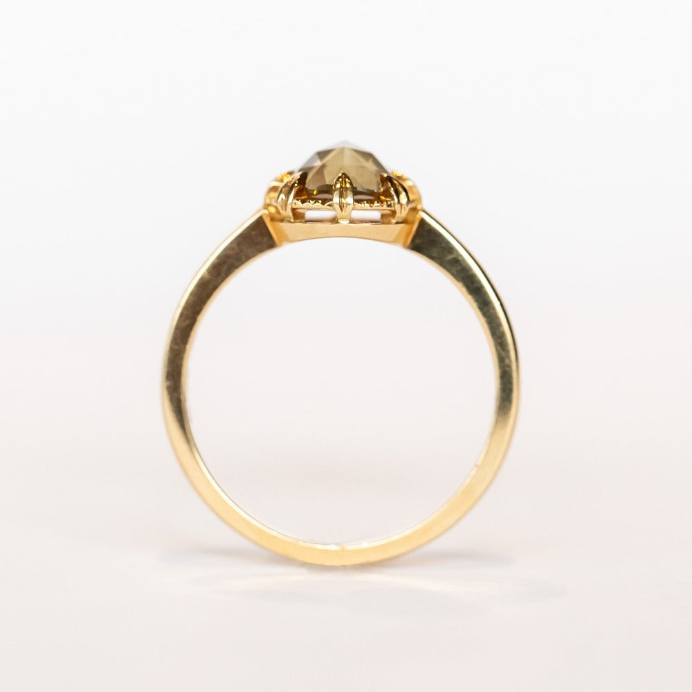 A rose cut cushion shaped diamond solitaire ring, set in an 8-prong, 18 karat yellow gold mounting.