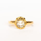 A rose cut cushion shaped diamond solitaire ring, set in an 8-prong, 18 karat yellow gold mounting.