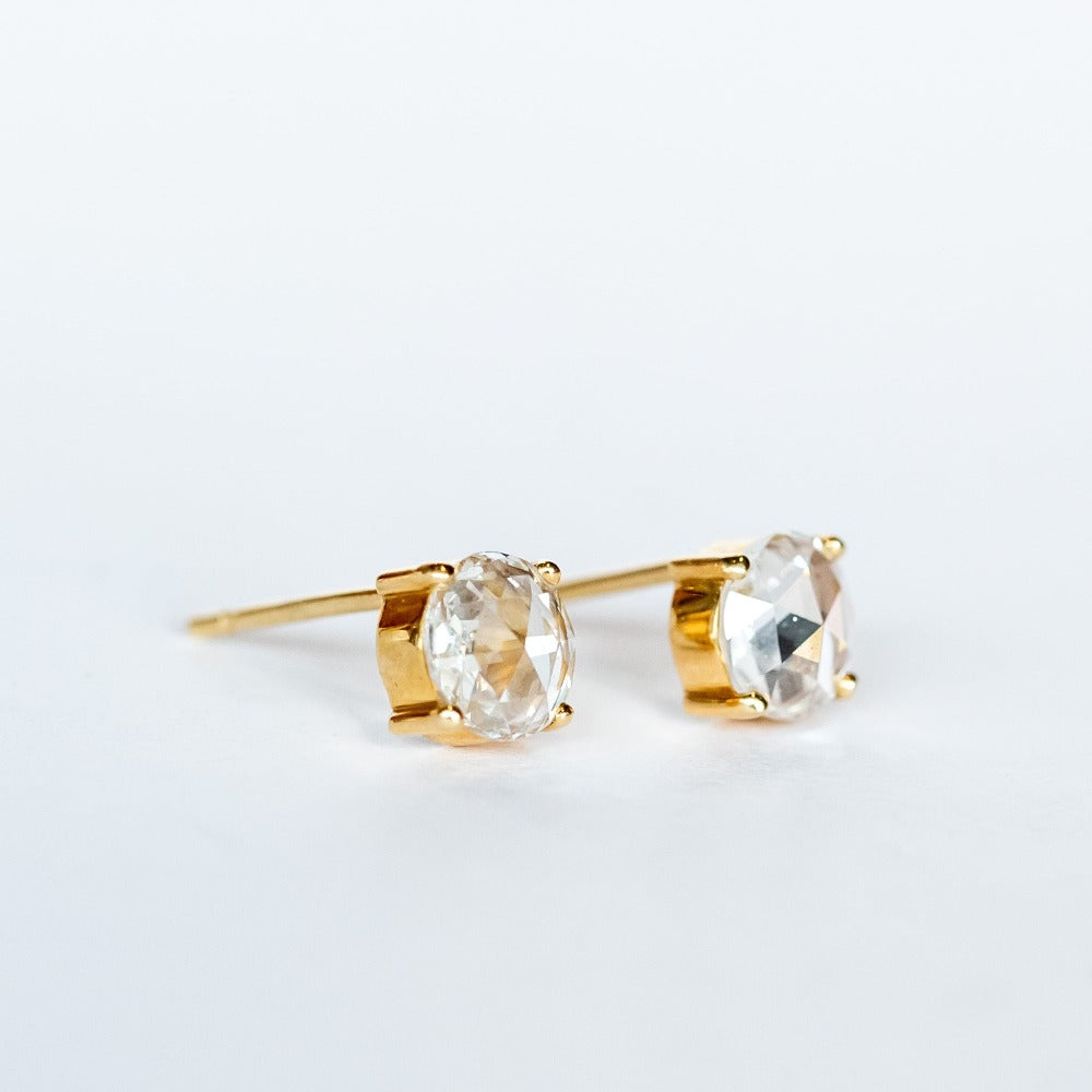 Round, rose cut diamond stud earrings in yellow gold prong mountings with post and push backs.