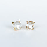 Round, rose cut diamond stud earrings in yellow gold prong mountings with post and push backs.