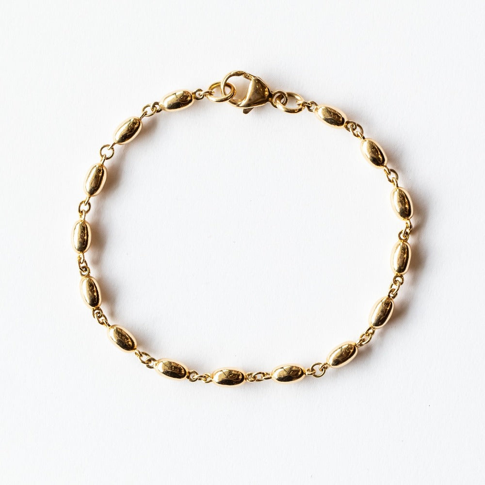 A solid gold oval link chain bracelet.