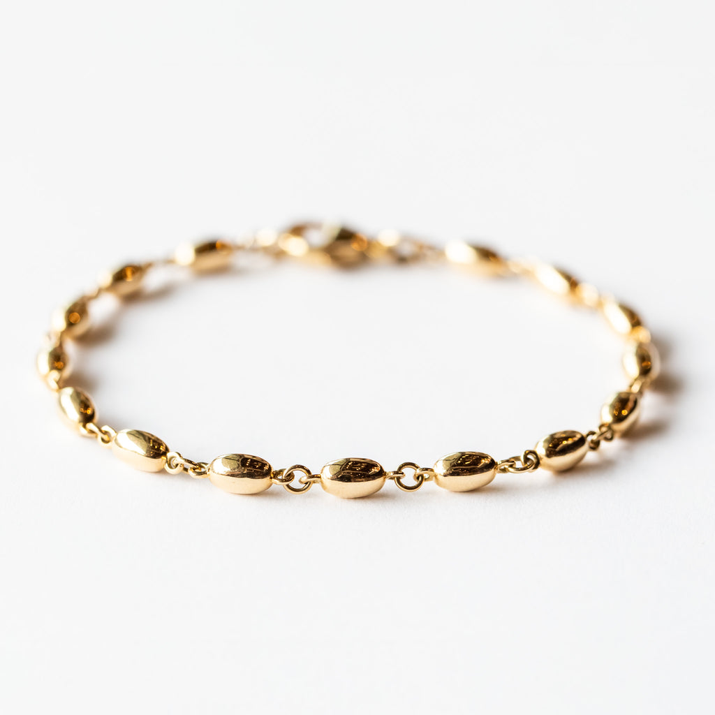 A solid gold oval link chain bracelet.