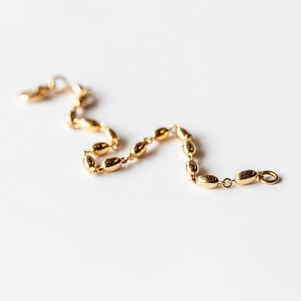 A solid gold oval link chain bracelet.