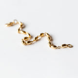 A solid gold oval link chain bracelet.
