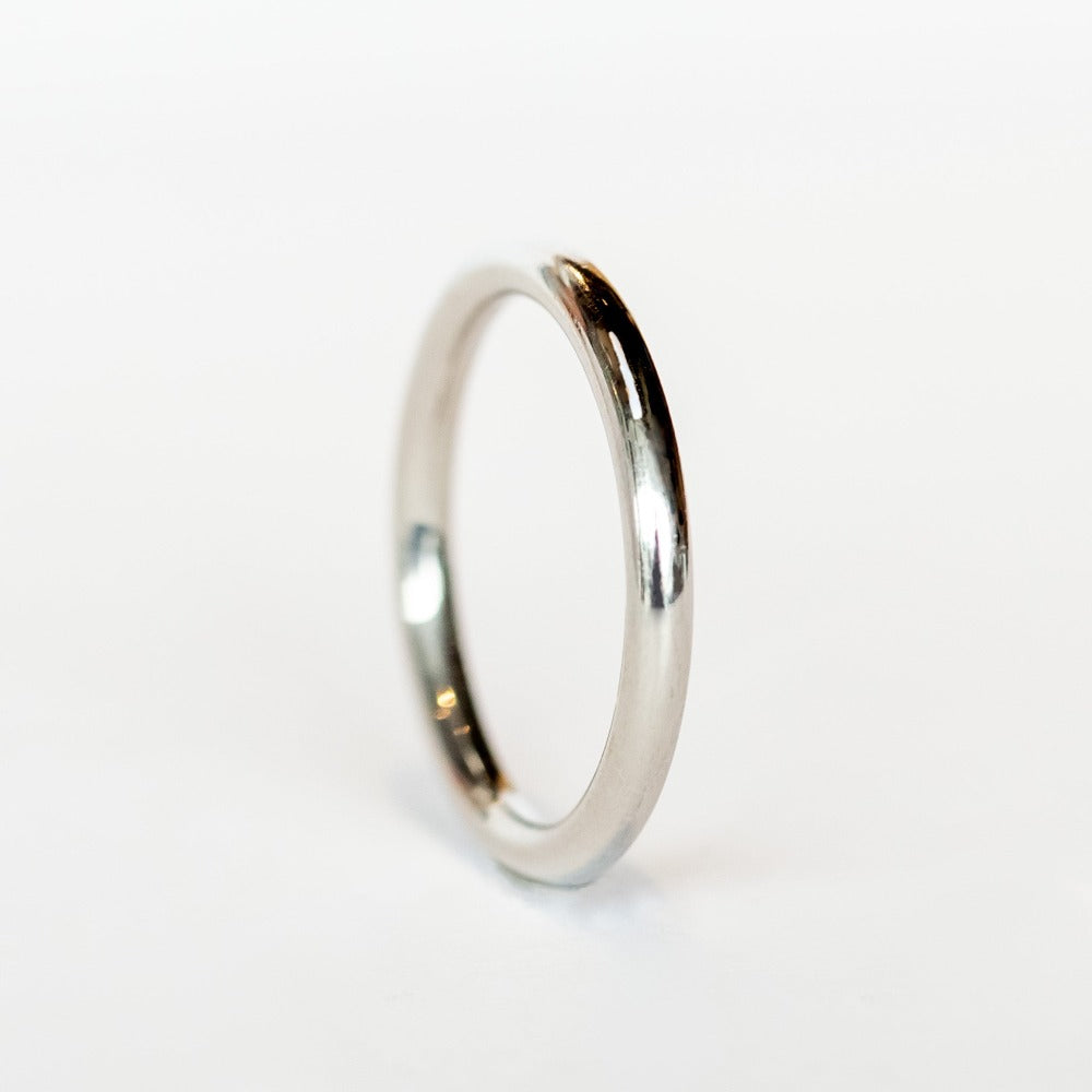 A rounded profile, polished platinum wedding band.