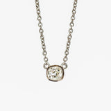 A cushion cut diamond in a platinum bezel setting with milgrain edge, stationed at the center of a platinum cable chain necklace.