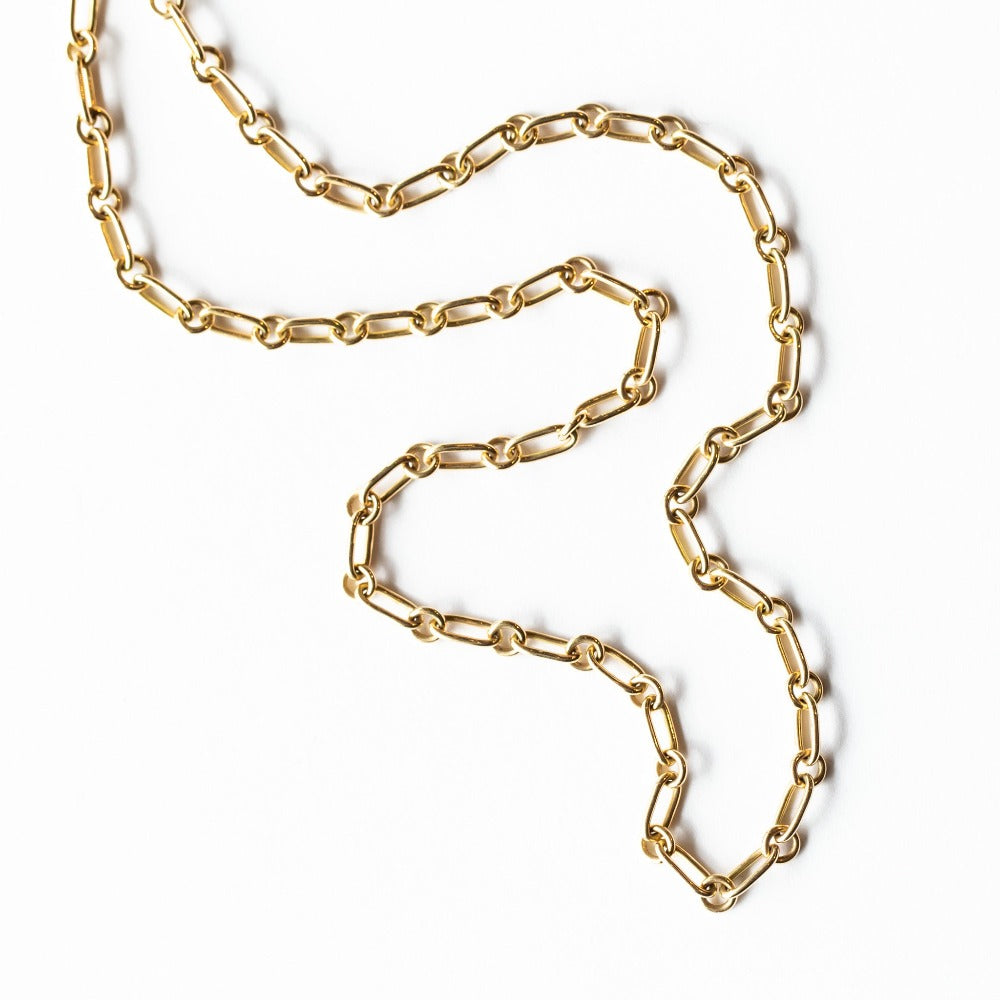 A gold chain necklace made up of alternating round and oval links.