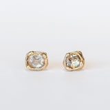 Raw champagne diamond stud earrings set in organic designed yellow gold.