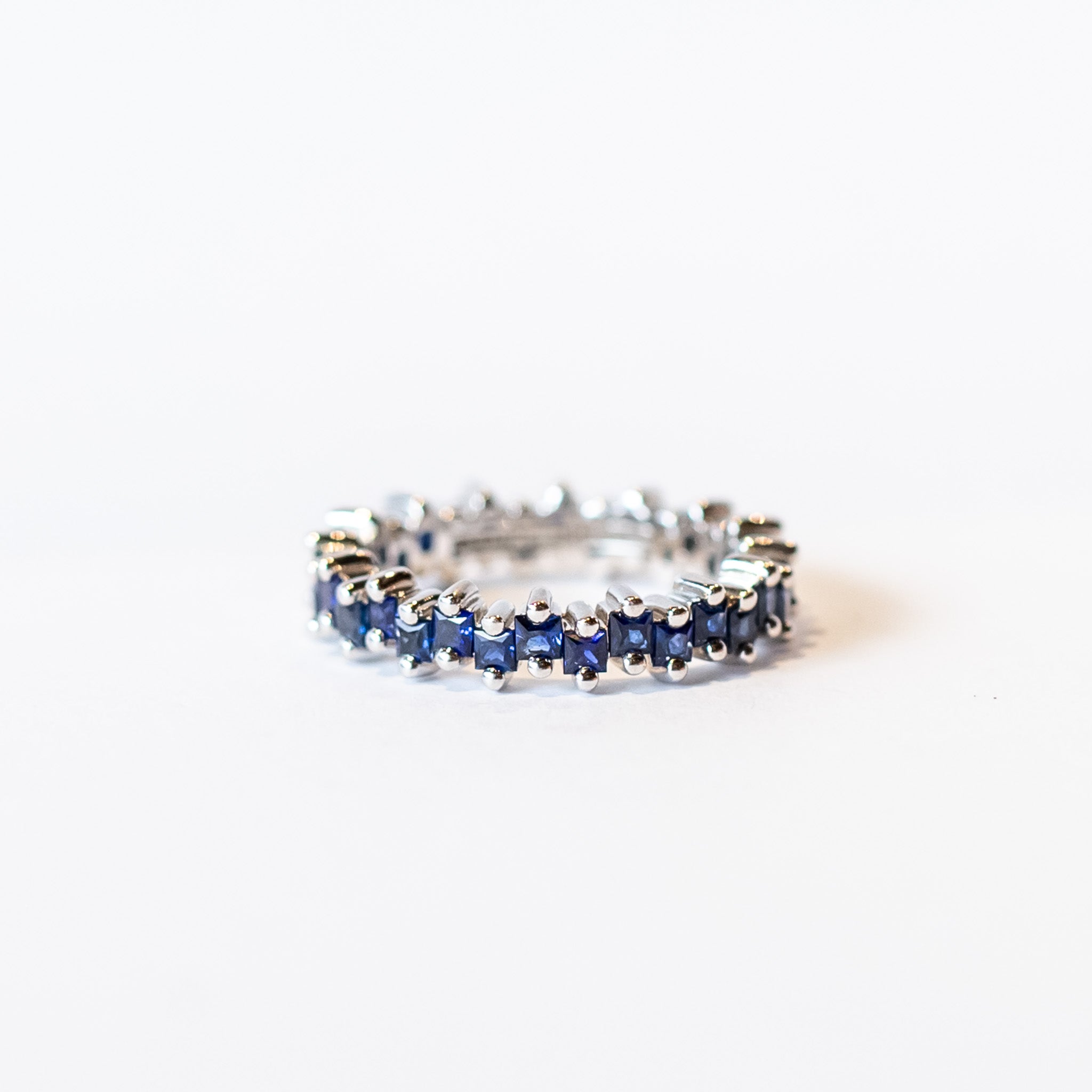 Suzanne Kalan | 18k Princess Midi Dark Blue Sapphire Eternity Band