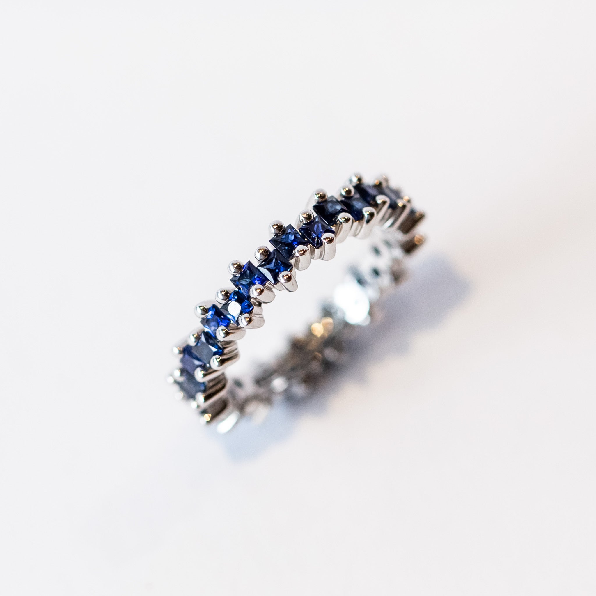 Suzanne Kalan | 18k Princess Midi Dark Blue Sapphire Eternity Band