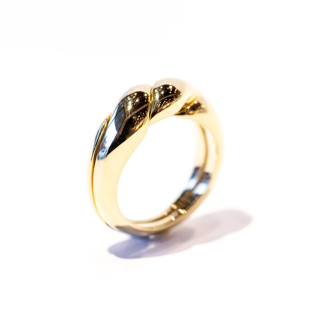 A two-part gimmel ring with a twisted design.