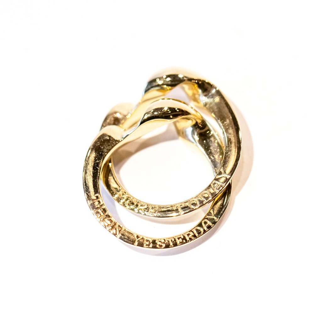 A two-part gimmel ring with a twisted design.