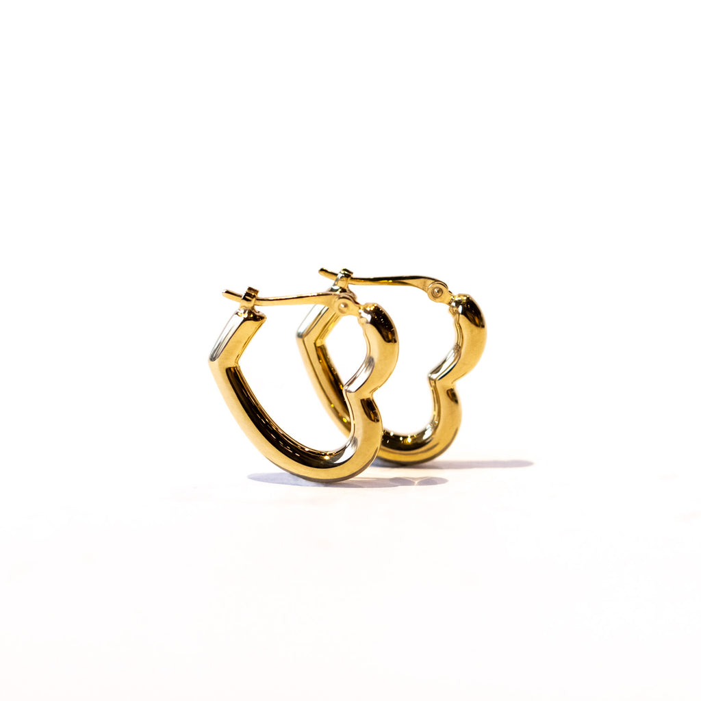A puffy heart-shaped gold hoop earring.