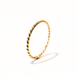 A thin gold band of two twisted wires.
