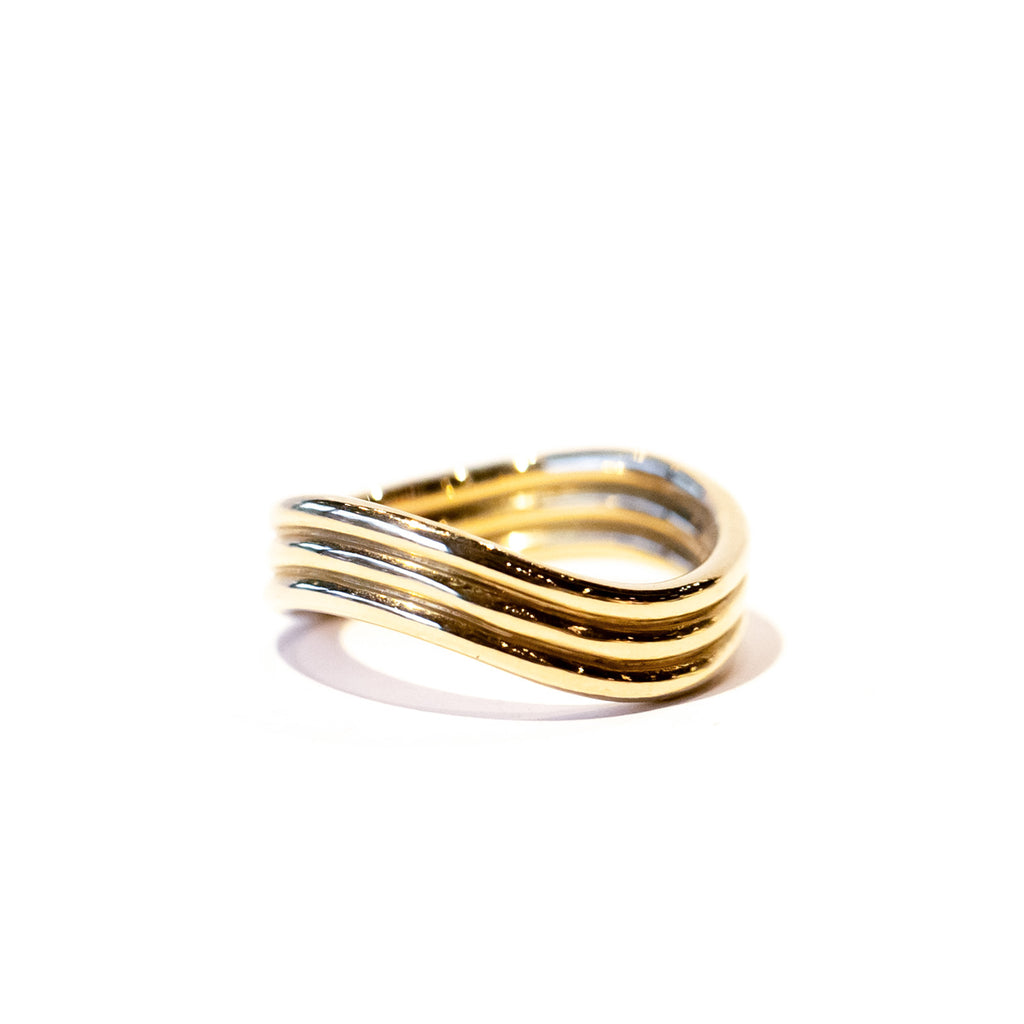 A three-banded wavy gold ring.
