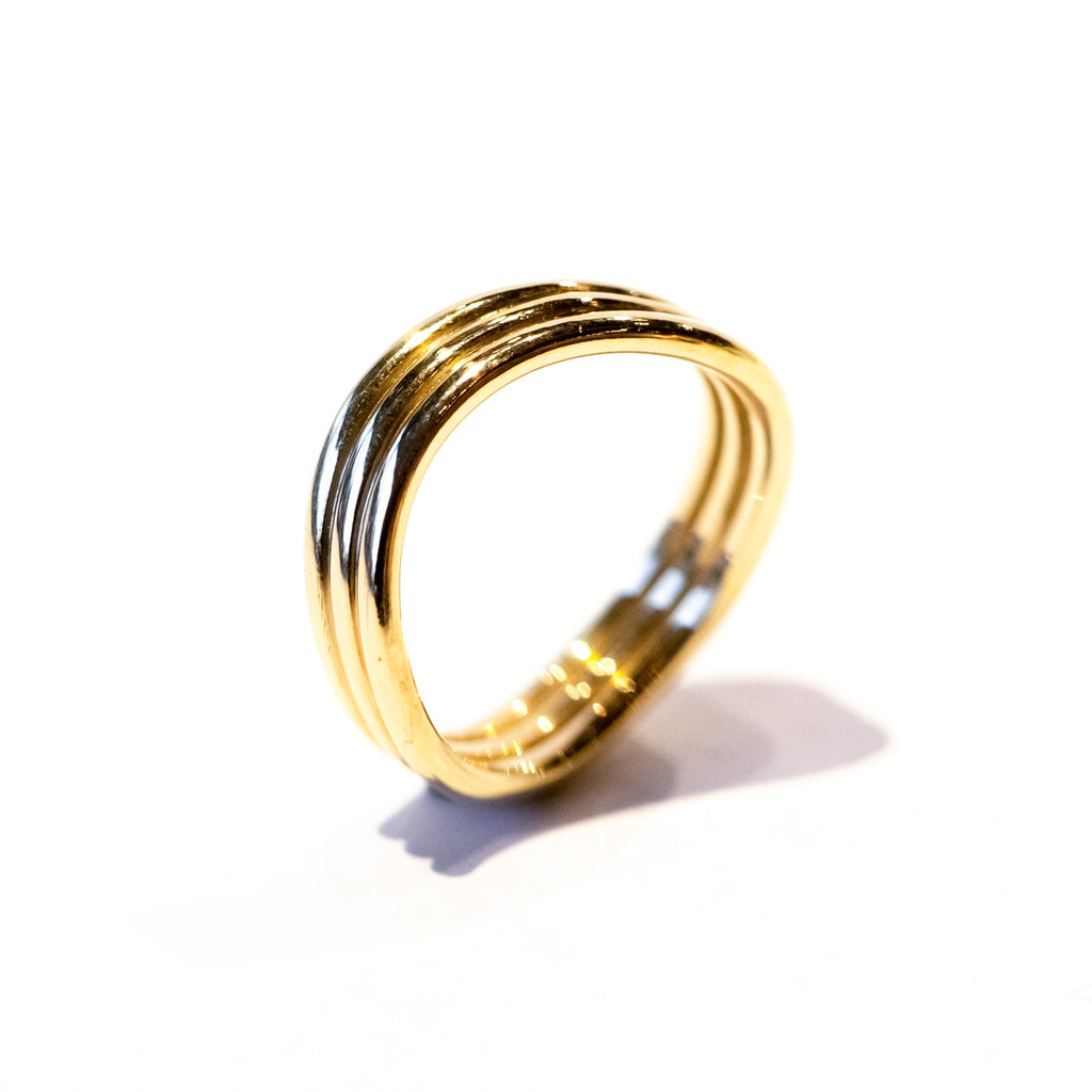 A three-banded wavy gold ring.
