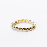 A twist-design yellow gold wedding band.