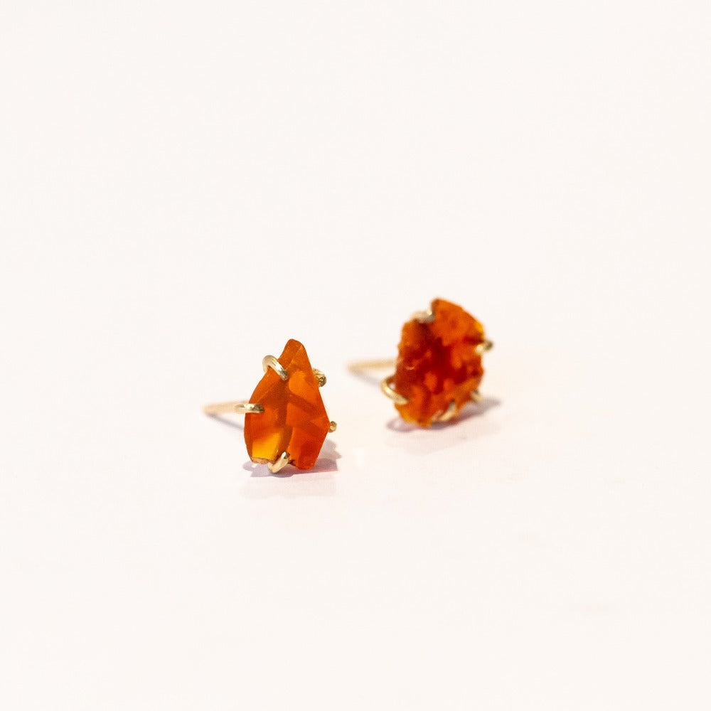 Rough faceted orange Mexican fire opal stud earrings in yellow gold.