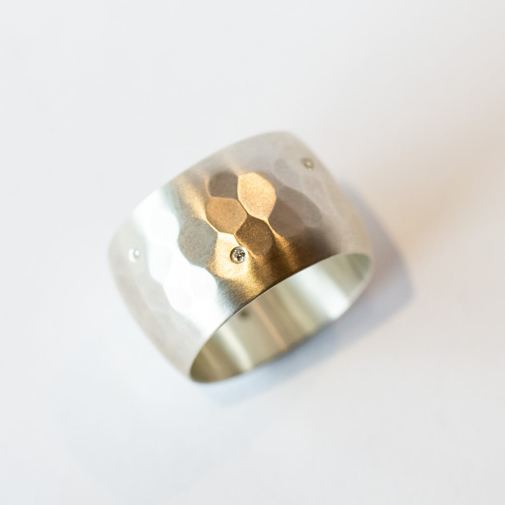 wide hammered sterling silver band with scattered white diamonds flush set