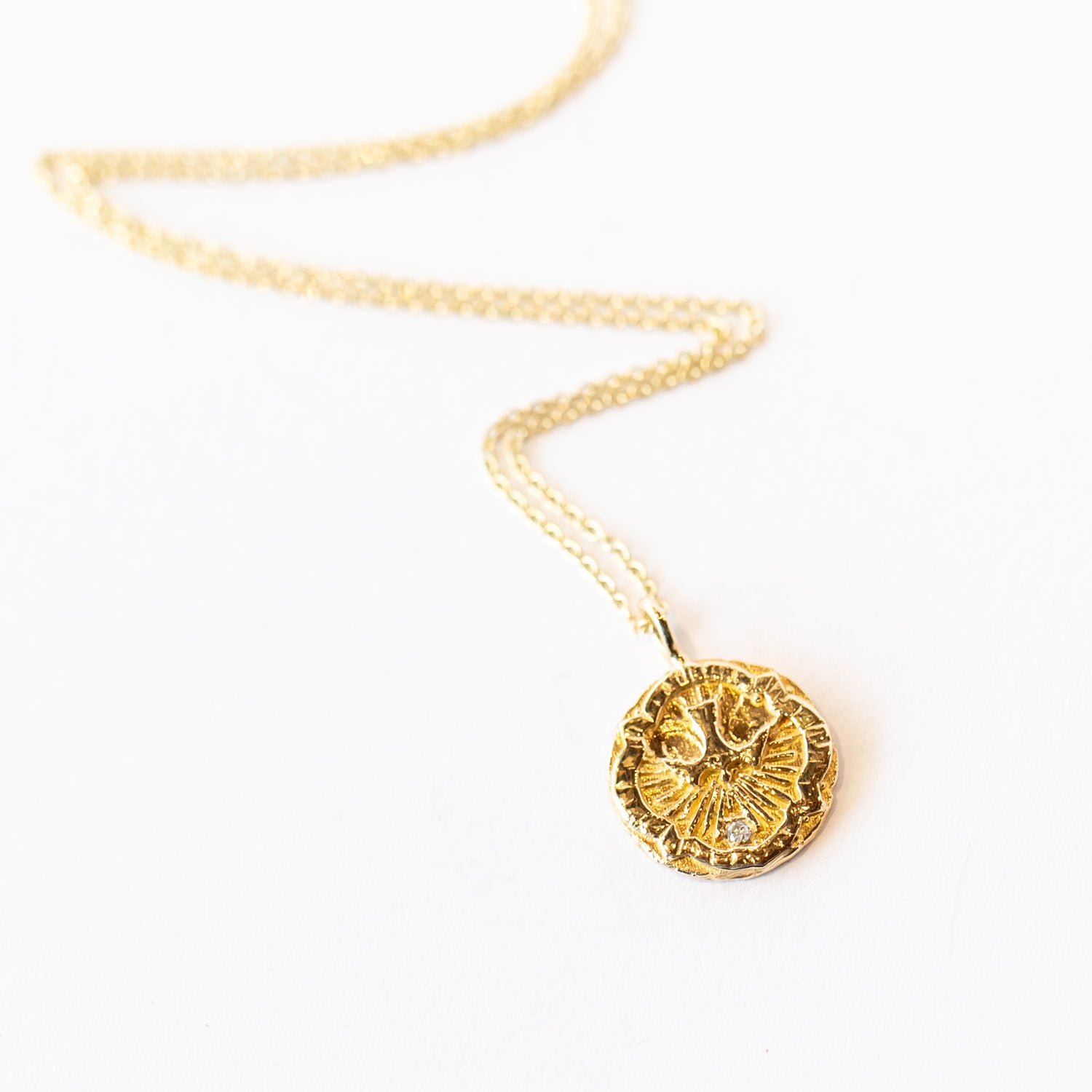 Communion by Joy gold necklace with dove engraving and diamond, front view