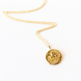 Communion by Joy gold necklace with dove engraving and diamond, front view