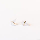 Stud earrings featuring kite-shaped chalcedony stones wrapped in a slender band of yellow gold.