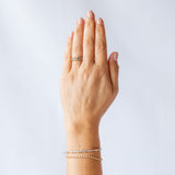 Four rose cut salt and pepper diamonds are set into a yellow gold band with beaded edge details. On hand.