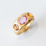 Three Stone Tapered Orange and Pink Sapphire Ring