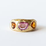 Three Stone Tapered Orange and Pink Sapphire Ring