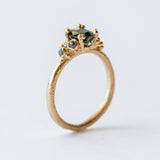 Ruth Tomlinson | Teal Sapphire and Diamond Encrusted Solitaire Ring