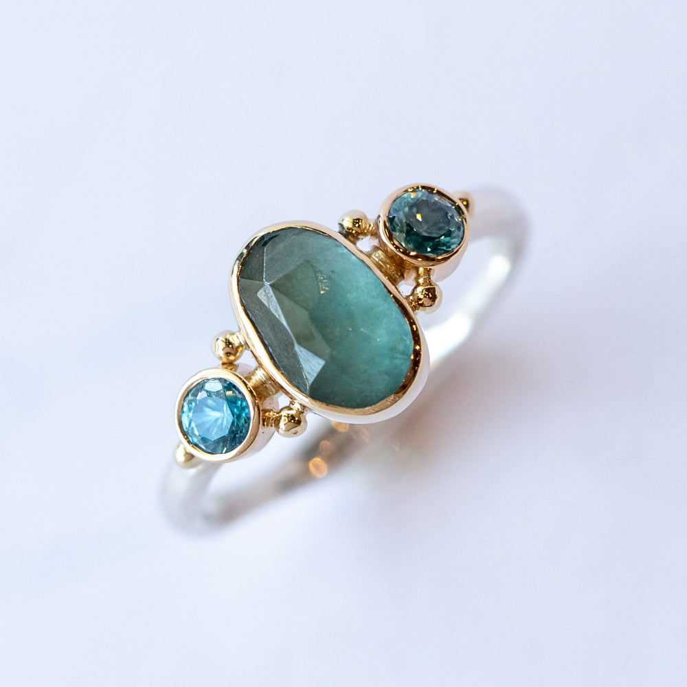 Grandiderite Ring with Blue Zircon