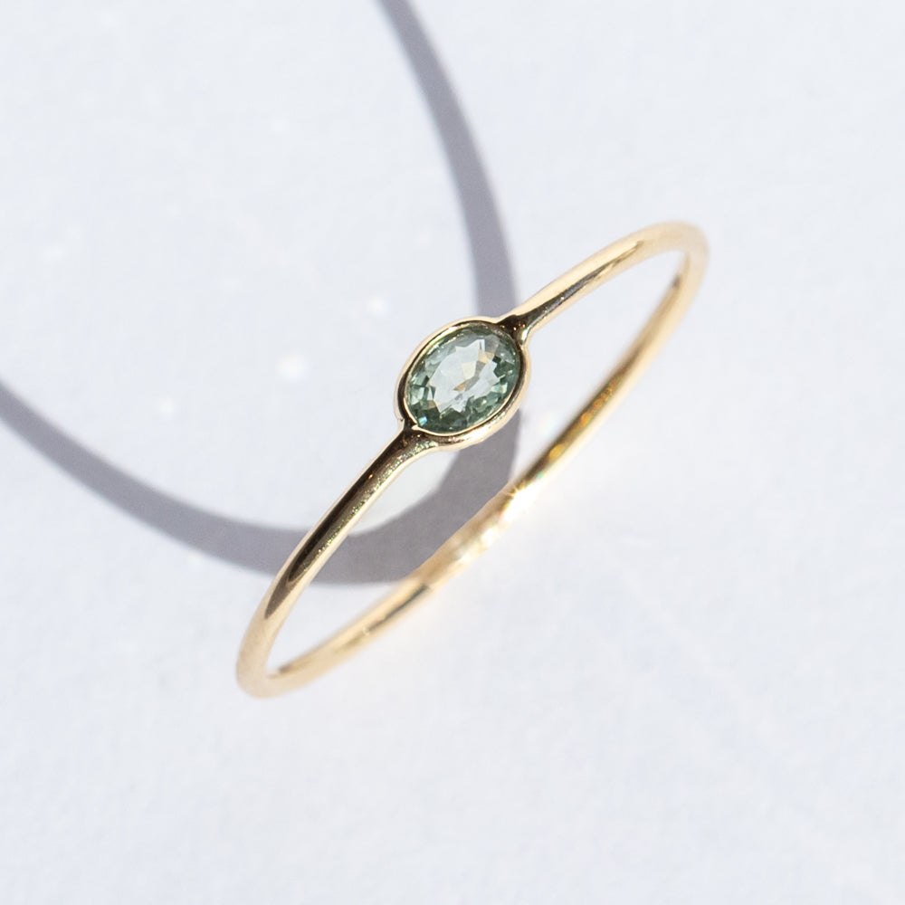 Tiny Horizontal Oval Light Green Sapphire Ring