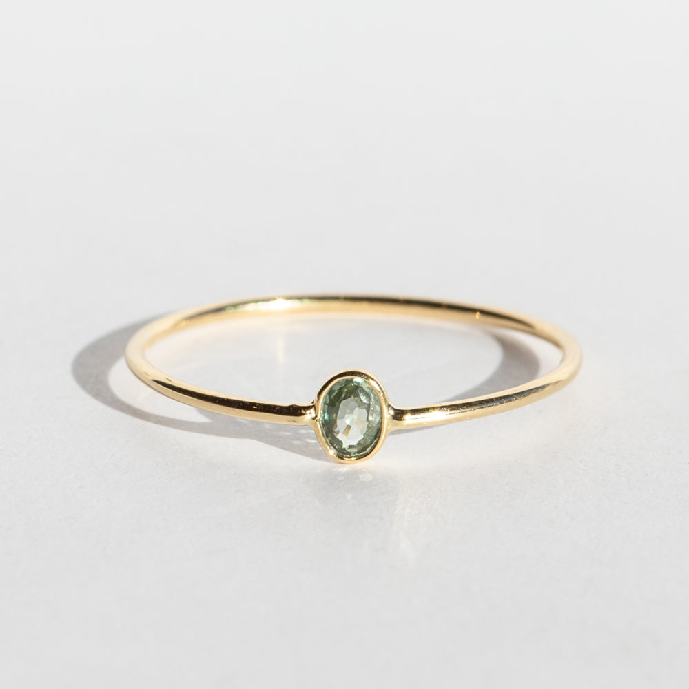 Tiny Vertical Oval Light Green Sapphire Ring