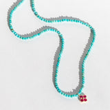 Turquoise Beaded Necklace with Ruby Flower Charm