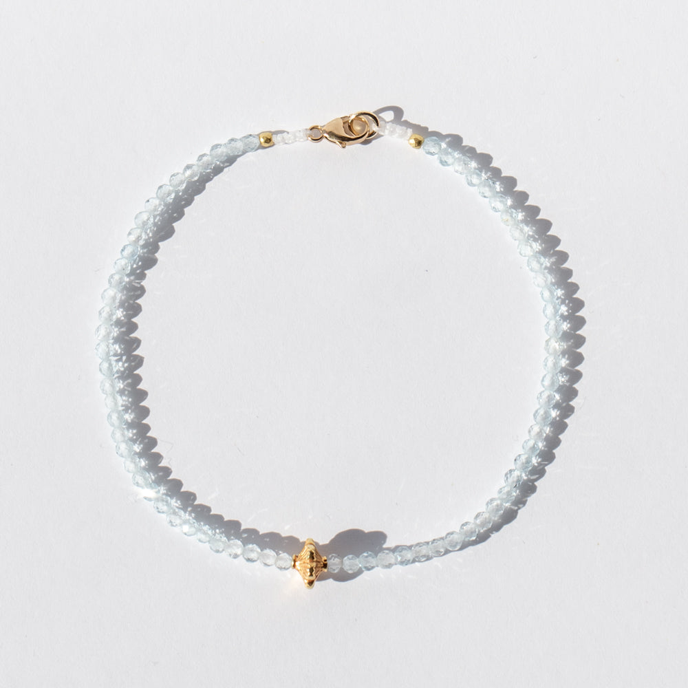 Light Blue Topaz Beaded Bracelet with Gold Flower Bead