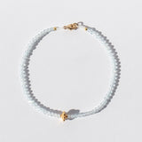 Light Blue Topaz Beaded Bracelet with Gold Flower Bead