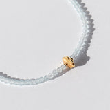 Light Blue Topaz Beaded Bracelet with Gold Flower Bead